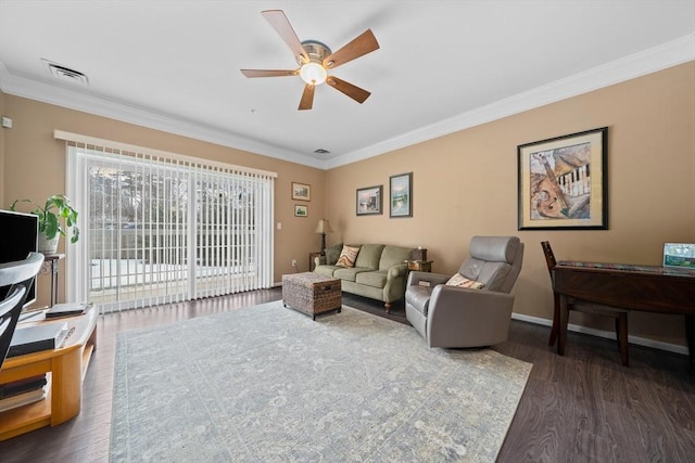 living area with a ceiling fan, visible vents, ornamental molding, and dark wood-style flooring