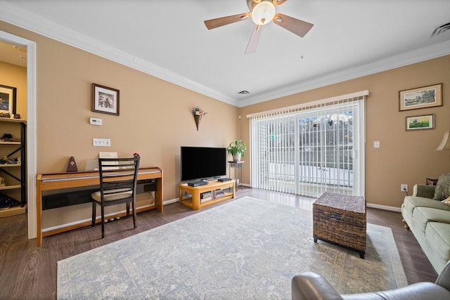 living room featuring ceiling fan, wood finished floors, visible vents, baseboards, and crown molding