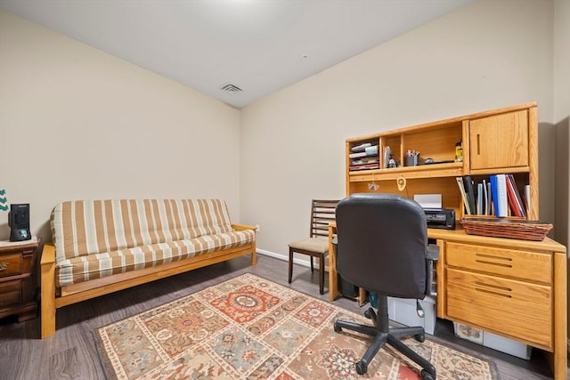 office space with wood finished floors, visible vents, and baseboards