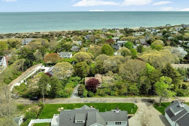 aerial view of property and surrounding area with nearby suburban area and a nearby body of water