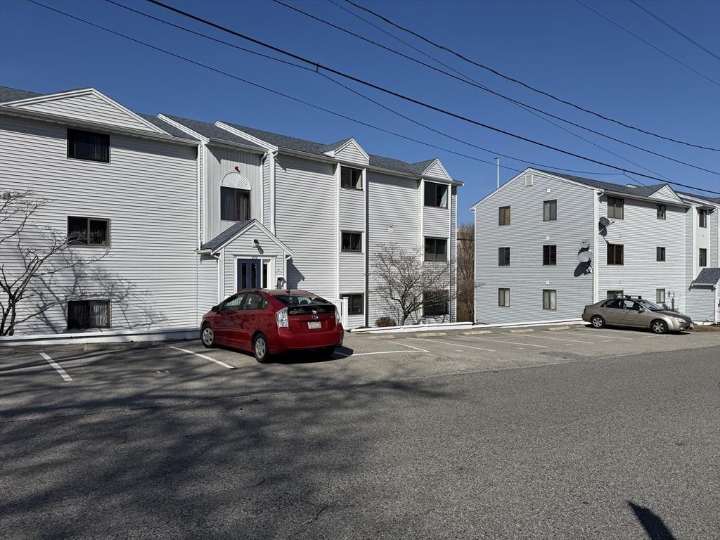 view of property with uncovered parking