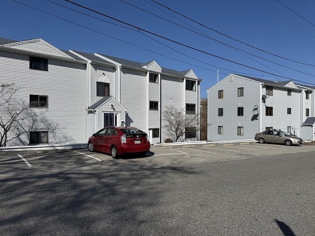 view of property with uncovered parking