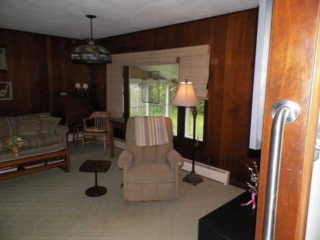 7 Maple Ln, Millbury, MA 01527 - living room featuring a baseboard heating unit, wood walls, and carpet