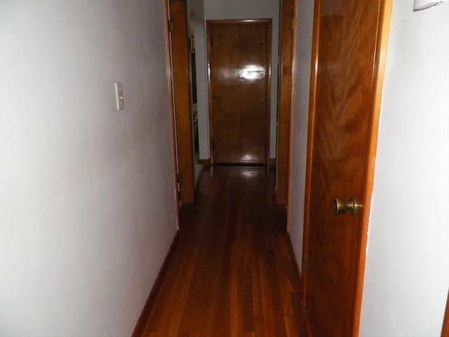 7 Maple Ln, Millbury, MA 01527 - hall with dark wood-style flooring and baseboards