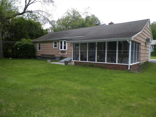 7 Maple Ln, Millbury, MA 01527 - back of house featuring a yard, a chimney, a sunroom, and a shingled roof