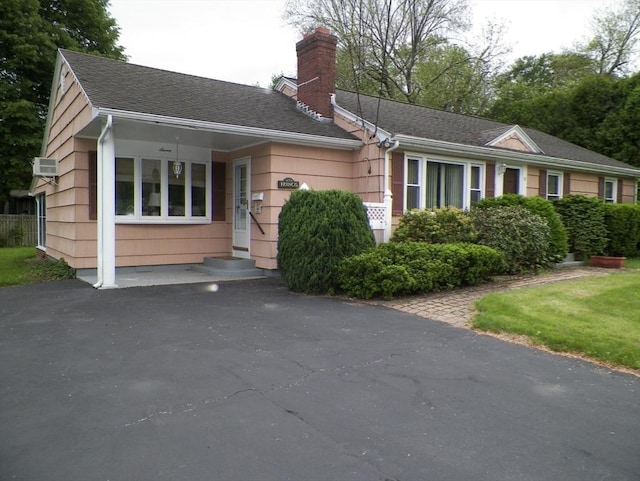 7 Maple Ln, Millbury, MA 01527 - view of front facade with a chimney and roof with shingles