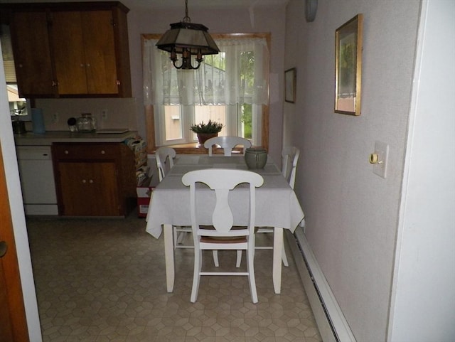 7 Maple Ln, Millbury, MA 01527 - dining area featuring a baseboard heating unit and a chandelier