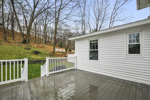 deck featuring a lawn