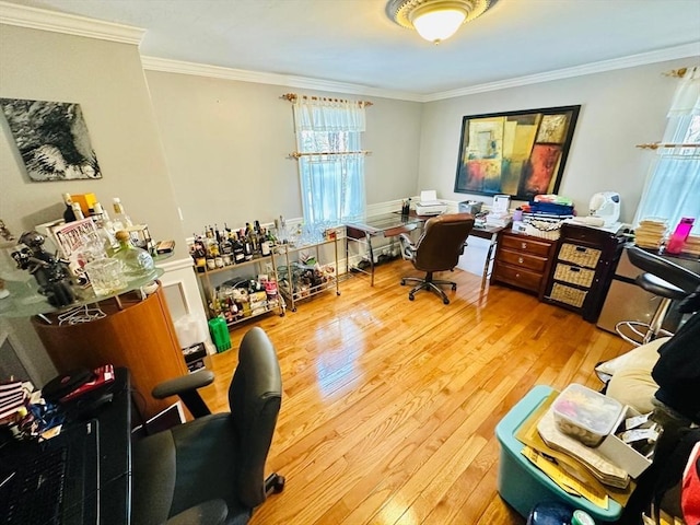 office area featuring wood-type flooring and crown molding