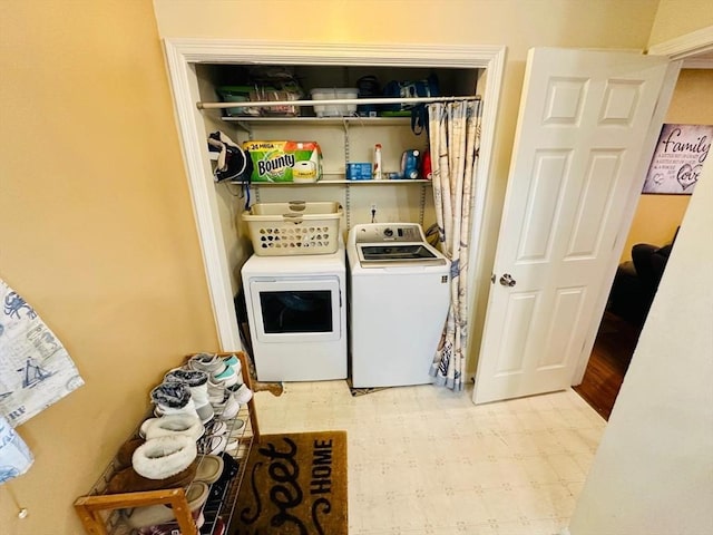 laundry area with washing machine and dryer