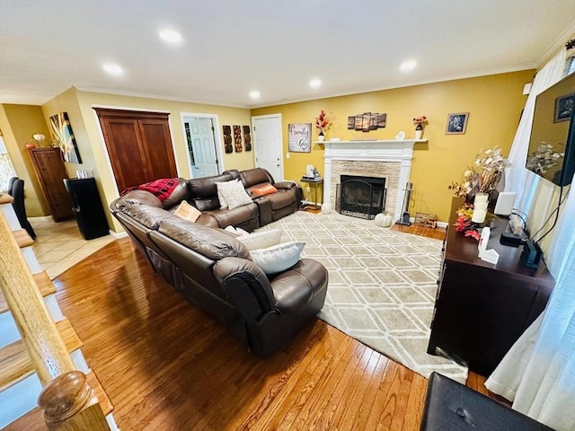 living room with a fireplace and light hardwood / wood-style flooring