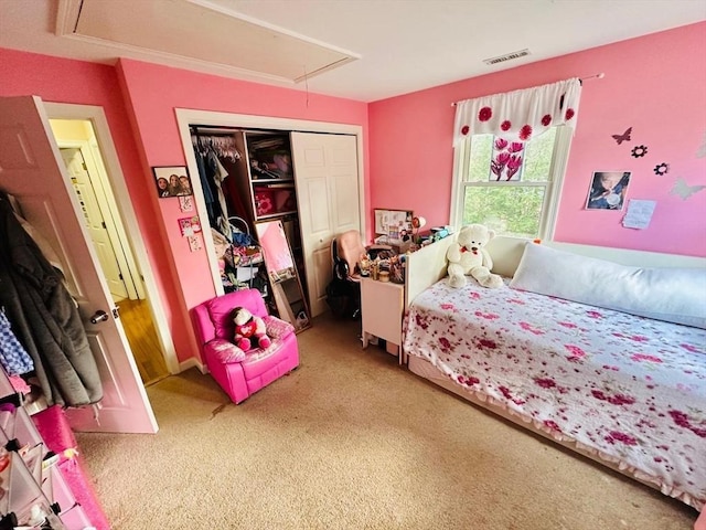 carpeted bedroom with a closet