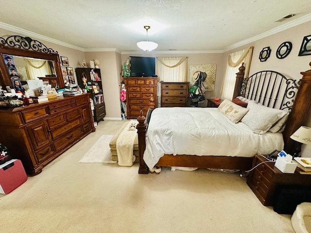 bedroom with ornamental molding and light carpet