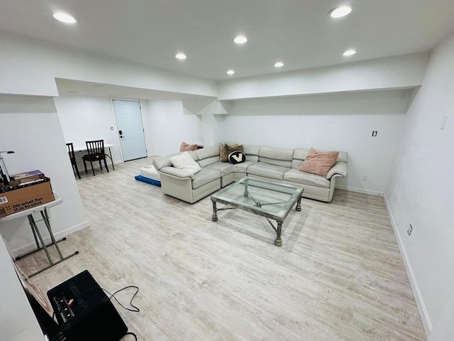 living room with light hardwood / wood-style flooring