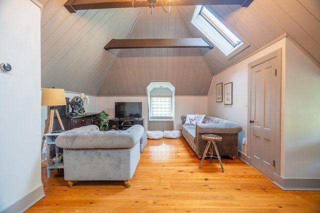 bedroom with light wood-style flooring and vaulted ceiling with skylight