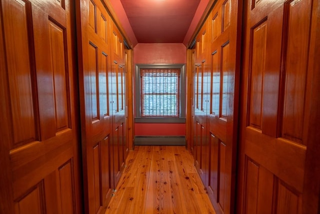 doorway with a baseboard radiator and light wood-style flooring
