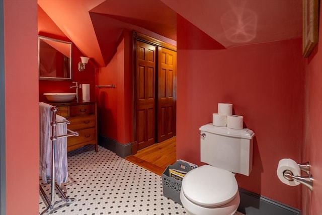 bathroom with toilet and vanity