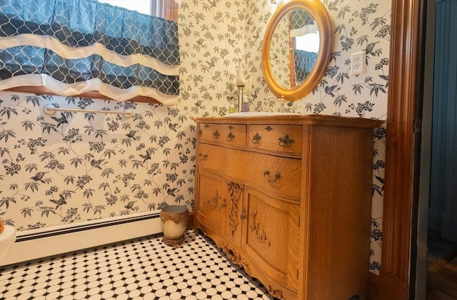 bathroom featuring vanity, a baseboard radiator, and wallpapered walls