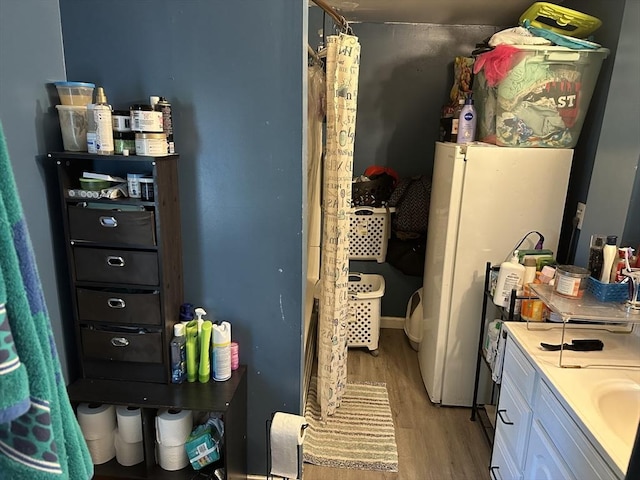 52 Burr St, Springfield, MA 01109 - full bathroom featuring wood finished floors, vanity, and a shower with shower curtain