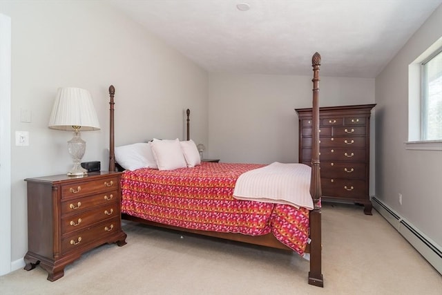 bedroom featuring light carpet and baseboard heating