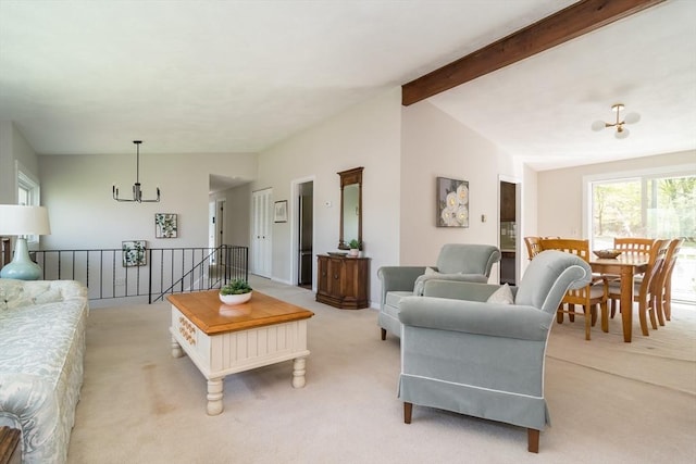 living area featuring light colored carpet, a notable chandelier, and vaulted ceiling with beams