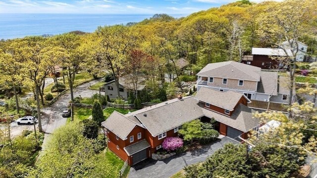 view from above of property with a heavily wooded area