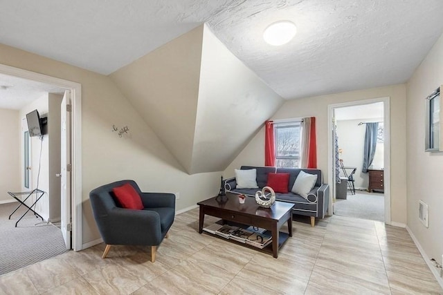 living room with lofted ceiling and a textured ceiling