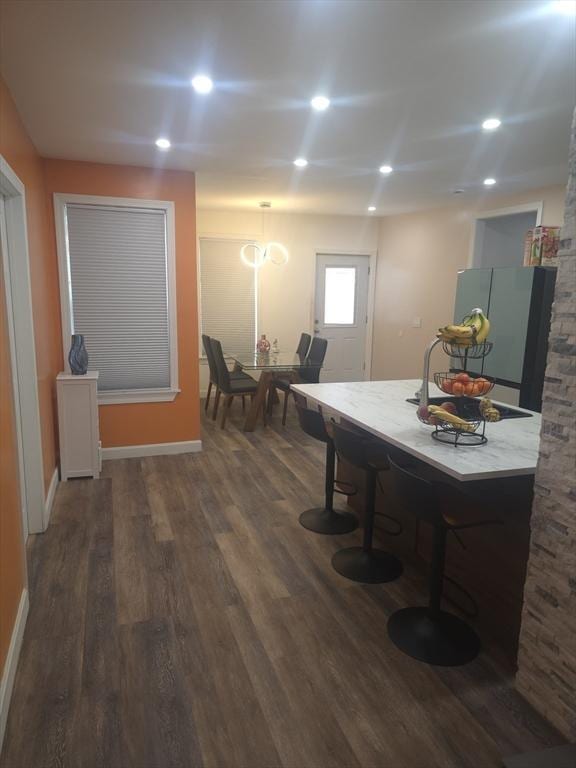 dining space featuring dark wood-type flooring