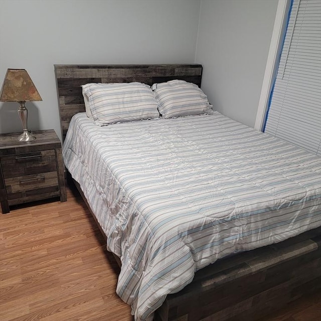 bedroom with light wood-type flooring