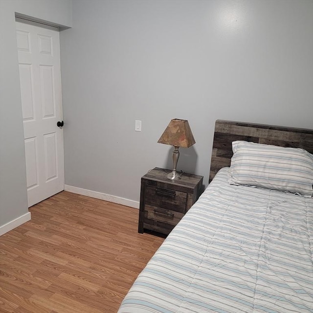 bedroom with light hardwood / wood-style flooring