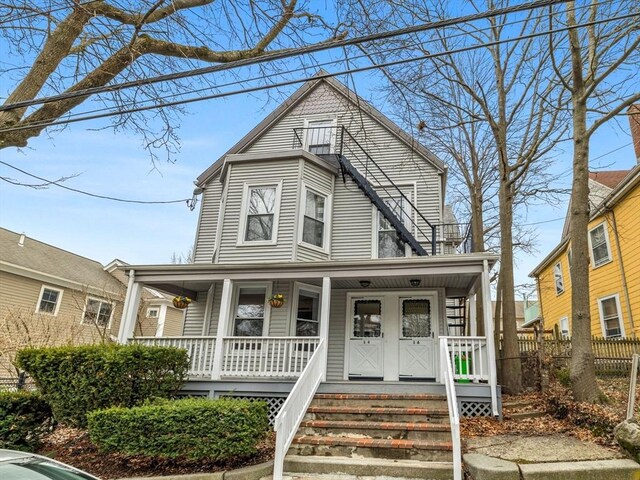 view of front of house with fence and a porch