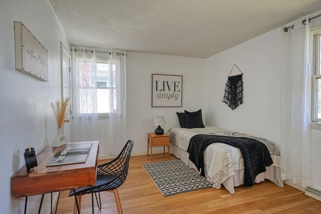 20 Fernglade Rd, Burlington, MA 01803 - bedroom with visible vents, baseboards, wood finished floors, and multiple windows