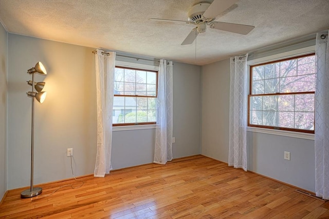 20 Fernglade Rd, Burlington, MA 01803 - spare room with visible vents, a ceiling fan, light wood-style flooring, and a textured ceiling