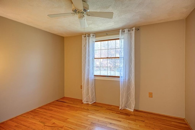 20 Fernglade Rd, Burlington, MA 01803 - unfurnished room featuring light wood-type flooring, a ceiling fan, and a textured ceiling
