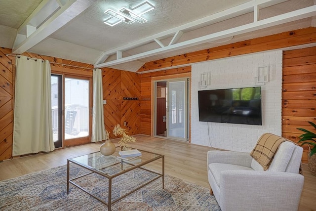 20 Fernglade Rd, Burlington, MA 01803 - living room featuring wooden walls, vaulted ceiling, and wood finished floors