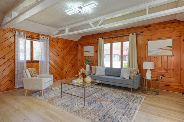 20 Fernglade Rd, Burlington, MA 01803 - living room featuring vaulted ceiling with beams, wooden walls, light wood finished floors, and a healthy amount of sunlight