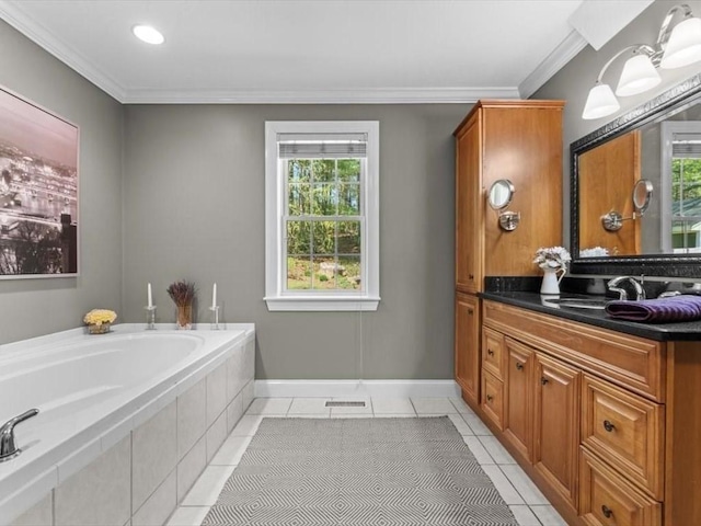 bathroom featuring tile patterned flooring, vanity, a bath, crown molding, and baseboards