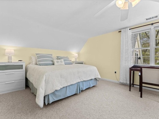 carpeted bedroom featuring lofted ceiling, ceiling fan, and baseboards