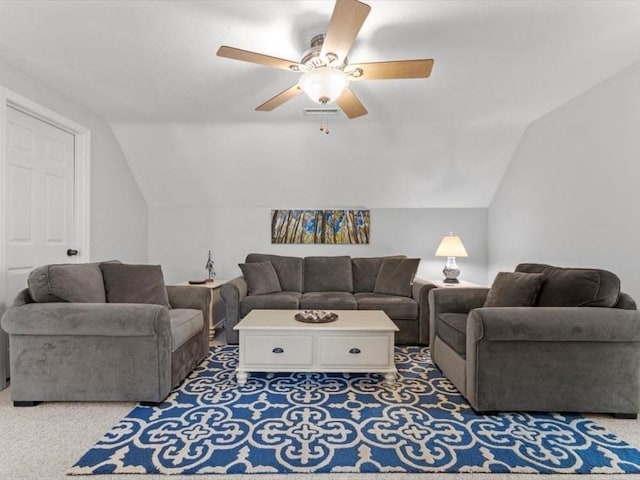 carpeted living room featuring lofted ceiling and ceiling fan