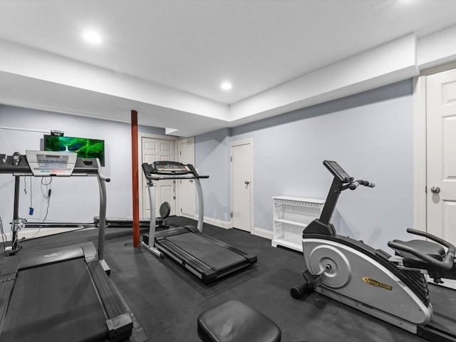 exercise area with baseboards and recessed lighting