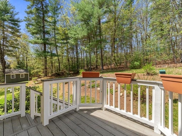 wooden deck featuring an outdoor structure