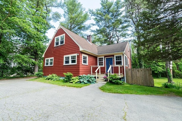 290 E St, Westwood, MA 02090 - view of front of home with a chimney and driveway