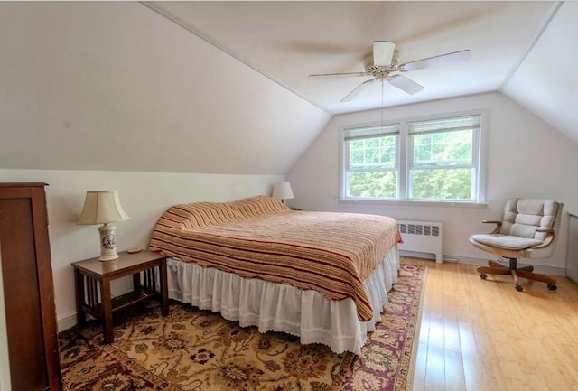 290 E St, Westwood, MA 02090 - bedroom featuring radiator, vaulted ceiling, hardwood / wood-style floors, and ceiling fan