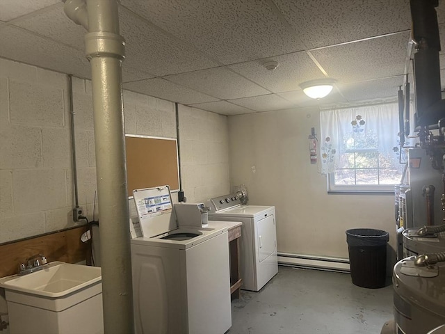 laundry room featuring separate washer and dryer, sink, and baseboard heating