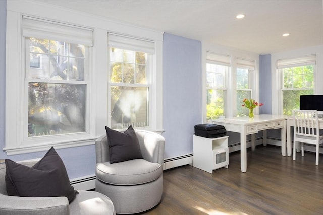 sitting room featuring dark wood finished floors, a baseboard radiator, and recessed lighting