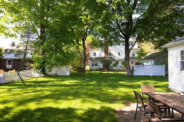 view of yard with outdoor dining space and a patio