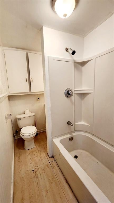 bathroom with toilet and tub / shower combination