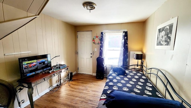 bedroom with wood-type flooring