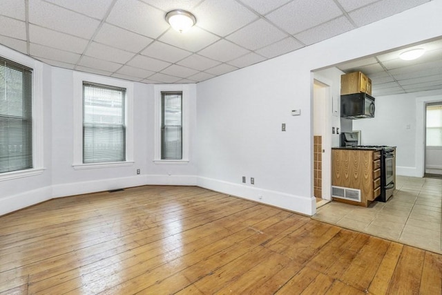 unfurnished room with light hardwood / wood-style flooring