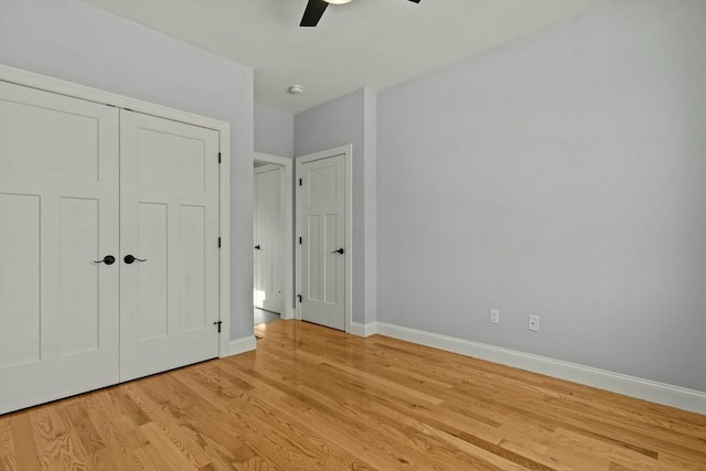 unfurnished bedroom featuring ceiling fan and light wood-type flooring